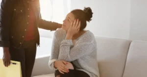 New mother speaks with a mental health support professional.