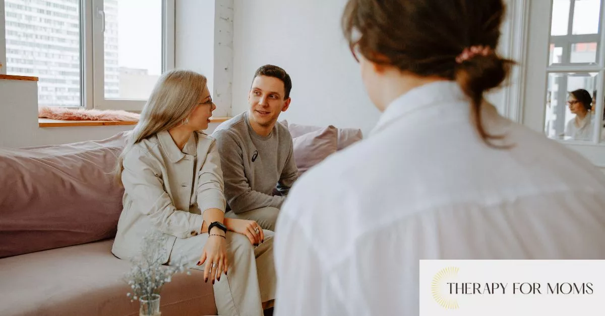 Couple in therapy session discussing emotional support options during fertility treatments with a licensed counselor.