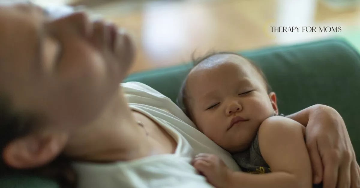 Mother lying down with sleeping baby on chest, quiet moment reflecting exhaustion and emotional complexity in postpartum motherhood.