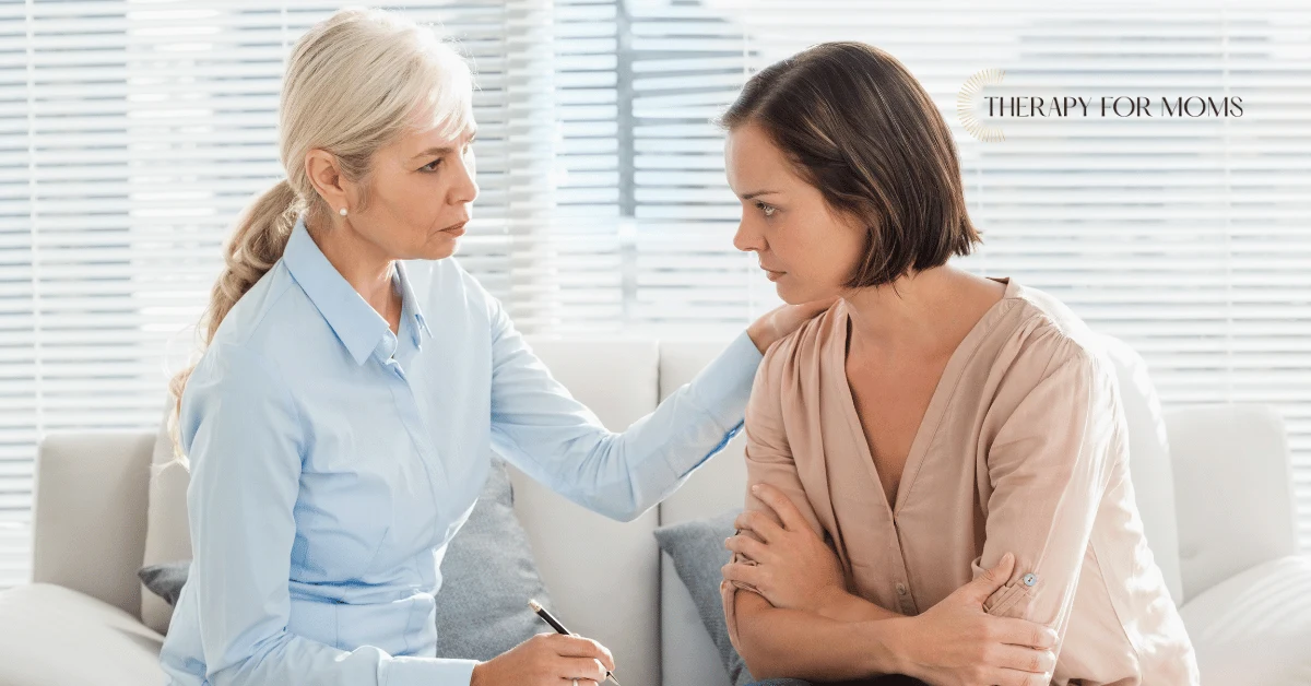 Perinatal mental health professional offering support to a concerned woman, highlighting the value of specialized therapy for pregnancy, postpartum adjustment, anxiety, and maternal well-being.